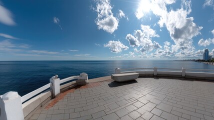 Scenic pier extends over calm waters surrounded by mountains and green trees on a cloudy day