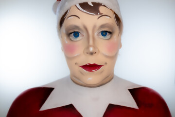 Woman with elf-on-the-shelf makeup for Christmas.