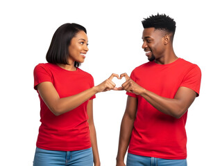 Smiling young diverse couple wearing red shirts making a heart symbol with their joined hands expressing heartfelt love unity and strong emotional connection on a simple dark backdrop