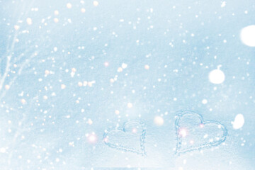 Valentine's Day. Abstract winter soft background with two hearts in the snow.