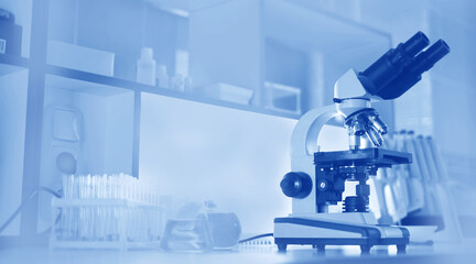 microscope and test tubes on the background of the laboratory.