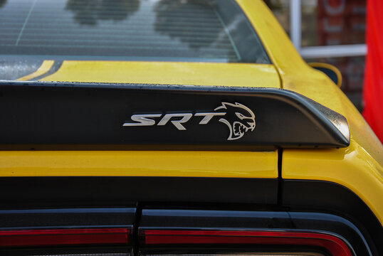 Vinnitsa, Ukraine, August 16, 2025: the back of a powerful yellow car of the American manufacturer Dodge SRT with a logo close-up. editorial