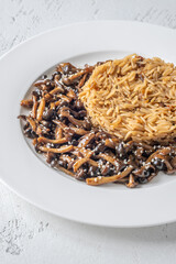 Savory fried rice topped with umami Shimeji mushrooms and golden sunny egg