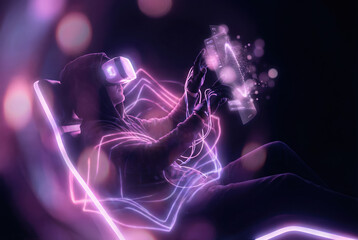 Immersive Gamer in Virtual Reality Enjoying a Futuristic Experience in Vibrant Neon Lights