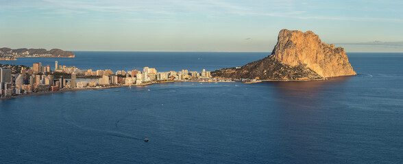Calpe cityscape and penyal d'ifac rock at sunset