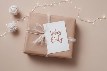 Minimalist gift package with handwritten card reading 'Vibes Only' surrounded by decorative string lights