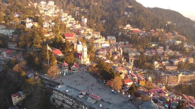 The ridge shimla drone view including mall road shimla and Christ church and people walking around the mall road shimla while video recording by drone. Hanuman mandir and Jakhu temple shimla.