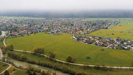 Fototapeta premium Rural homes and distant alpine peaks