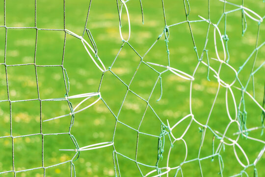 Outdoor goal net mended with black zip ties