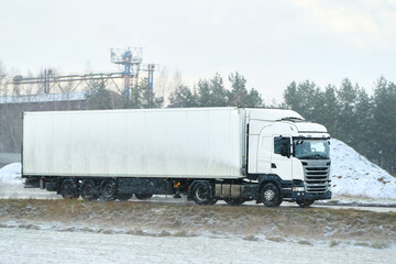 Cargo truck on snowy rural road