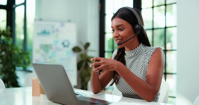 Tech support, laptop and business woman in call center, typing or troubleshooting for network query. Indian person, computer and IT consultant talk for customer service, smile or help with connection