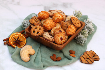 Table with various Christmas cookies, biscuits, and pastries for the Advent and Christmas season.