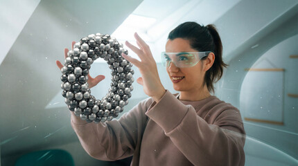 Woman Interacting With Metallic Toroid Structure in AR Environment