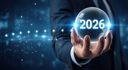 Businessman holding crystal ball with 2026, representing future predictions and technology trends. image conveys sense of innovation and foresight