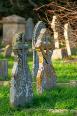 Ancient gravestones in the graveyard of Holy Cross Church in Seend, Wiltshire. 