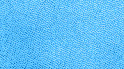 Macro shot of bright blue textile texture with linear grid pattern. Natural background with subtle...
