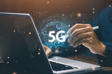 Next generation 5G technology concept showing a user interacting with a glowing digital globe displaying 5G, symbolizing ultra-fast connectivity, and advanced mobile communication.