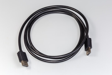 DisplayPort cable with full-size connectors closeup in selective focus