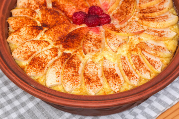 Cottage cheese casserole with apple slices on top, fragment