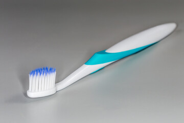 Toothbrush with soft bristles, close-up in selective focus