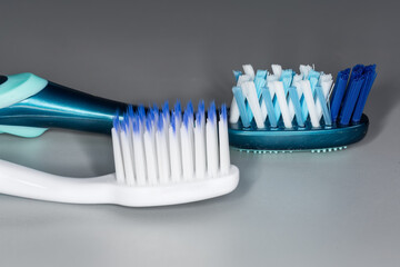 Toothbrushes working parts with soft and hard bristles, close-up