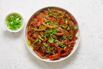 Funchoza with chicken and vegetables and teriyaki sauce