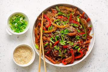 Funchoza with chicken and vegetables and teriyaki sauce