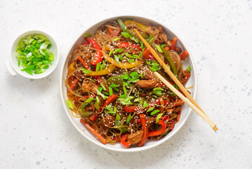 Funchoza with chicken and vegetables and teriyaki sauce