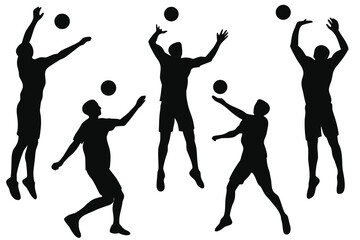 Silhouettes of volleyball players in action during a game or practice session