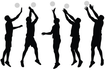 Silhouettes of volleyball players in action jumping and hitting the ball