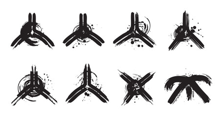Abstract brushstroke symbols set modern artistic design elements featuring a grunge texture and ink splatters, perfect for creative graphic projects and contemporary branding.