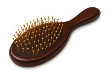 Wooden hairbrush with golden massage pins for detangling and styling hair. Personal care and beauty tool on透明 background