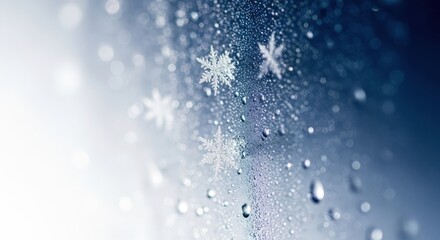 Close up of snowflakes falling on a wet surface