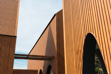Naklejka premium Modern architecture with vertical coated wood metal steel and geometric design