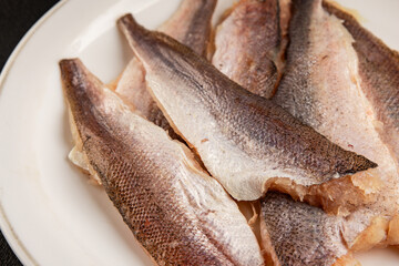 Hake fillet raw fish seafood healthy food main course ingredient appetizer fresh gourmet food table setting rustic food top view copy space pescatarian diet