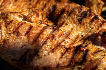 Pork chops, steak, sausages on barbecue grill