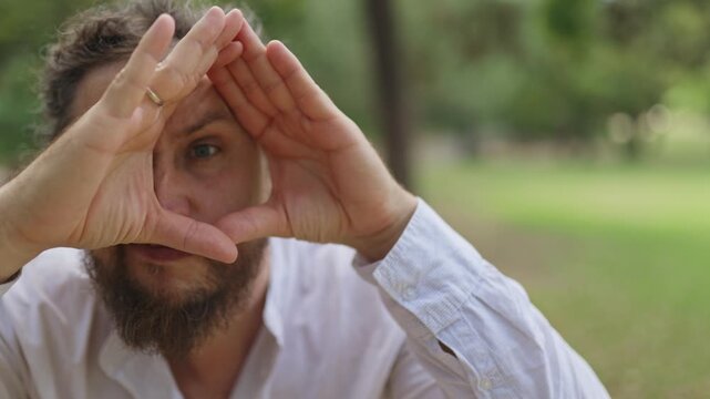 Funny man making grimaces and gestures to camera