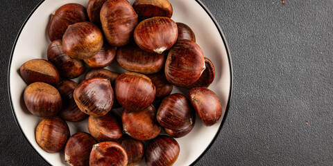 Edible chestnuts delicious treat tasty snack fresh gourmet food background on table rustic food top view copy space