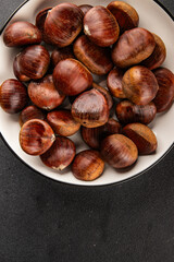 Obraz premium Edible chestnuts delicious treat tasty snack fresh gourmet food background on table rustic food top view copy space