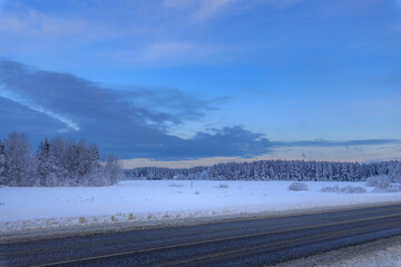 Snowy field with a blue sky in the background
