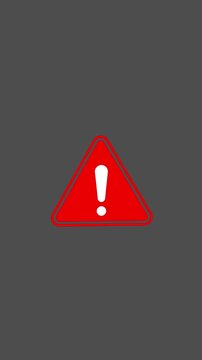 Animated red alert icon on vertical dark screen background in 4k