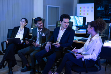 Diverse high performing team of data analysts and IT professionals collaborating in a control room. innovation, global business strategy, cybersecurity, and financial technology growth