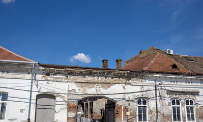 Building with a white facade and red roof