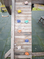 Wooden structure with a variety of colored rocks on it