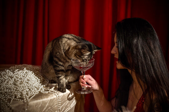 Gorgeous brunette European woman in sparkle red dress at party, fashionable concept
