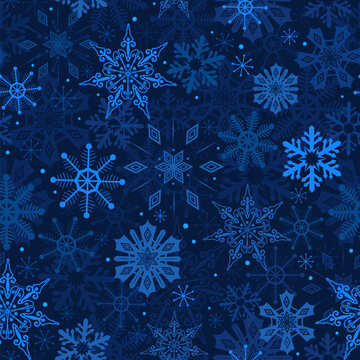 Snowflakes on blue background winter seamless pattern. Christmas New year holiday backdrop. Snow stars in night sky. Deep blue winter repeat design for textile fabric, wrapping paper, packaging print.