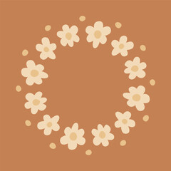 Cute round frame with daisy flowers in soft beige colors isolated on brown background.