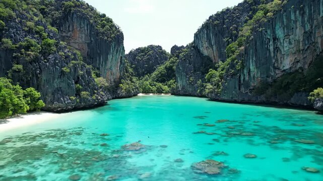 Aerial Drone View of a Tropical Paradise Lagoon with Turquoise Water and Cliffs.