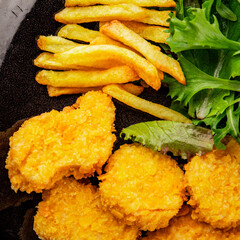 Nuggets and french fries fast food tasty snack fresh delicious gourmet food fonna on the table rustic food top view copy space
