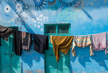 Laundry clothes hanging in front of the house